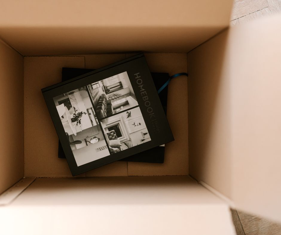 An open box with a photo album inside.